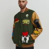 Shop Keith Haring Holding Hands Varsity Jacket Varsity Jackets